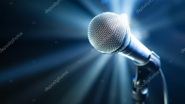 depositphotos_10238625-stock-photo-microphone-on-stage-with-blue