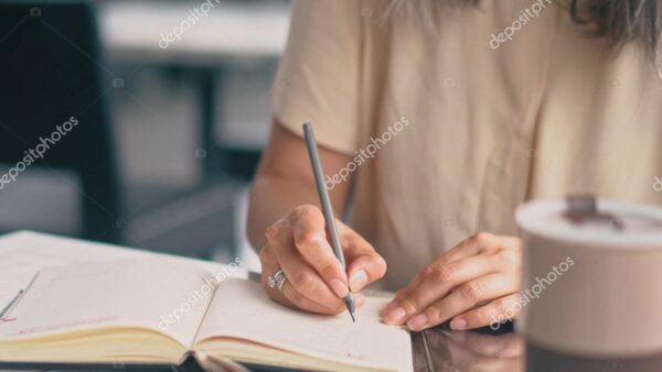 depositphotos_298212170-stock-photo-the-woman-is-writing-in